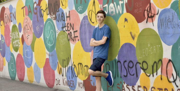 teen boy portrait near graffiti wall basel switzerland 21